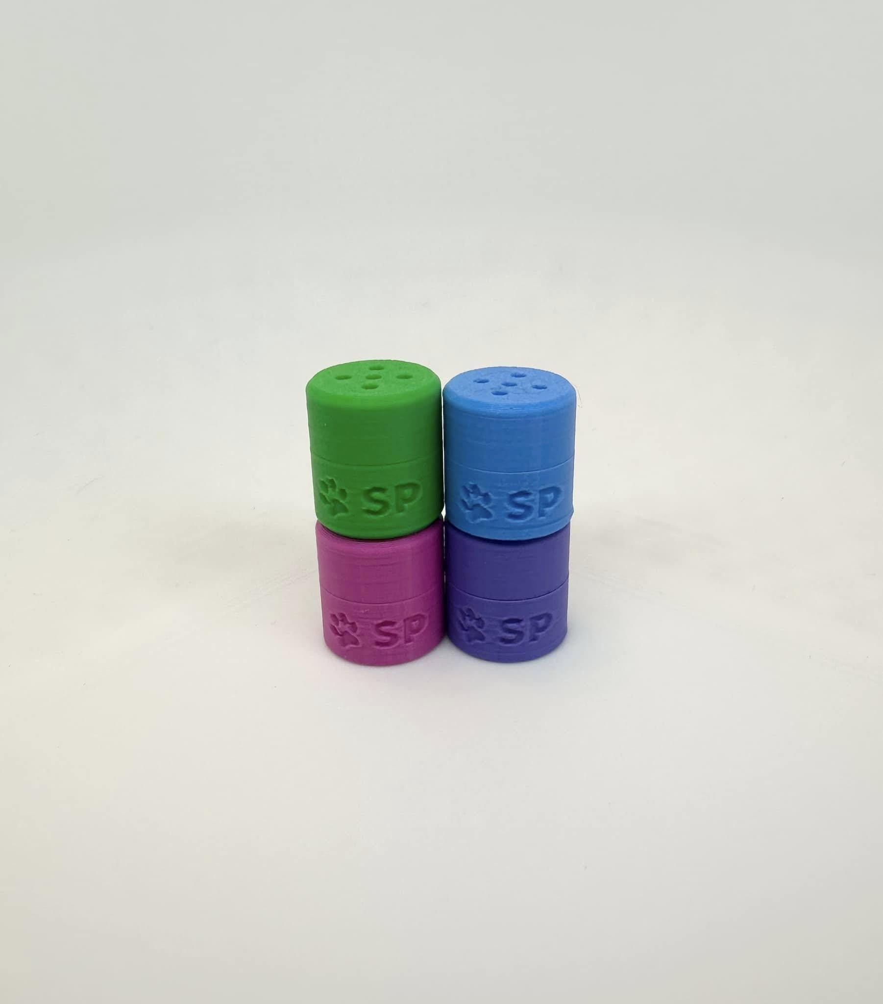 The BOLDS Tiny Hides pack, designed for K9 nosework training, includes Magenta, Cyan, Green, and Purple magnetic scent detection vessels. Made from durable, eco-friendly PLA, these hides are perfect for improving your dog’s scent detection skills.