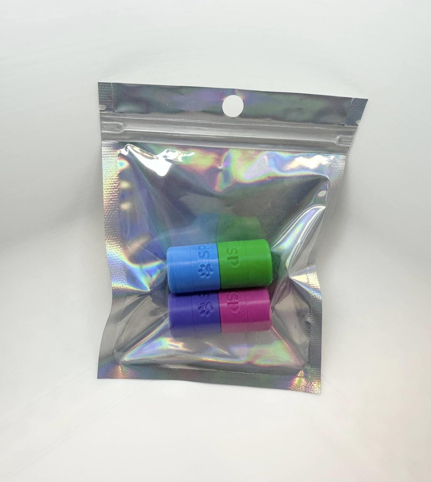 The BOLDS Tiny Hides pack, designed for K9 nosework training, includes Magenta, Cyan, Green, and Purple magnetic scent detection vessels. Made from durable, eco-friendly PLA, these hides are perfect for improving your dog’s scent detection skills.