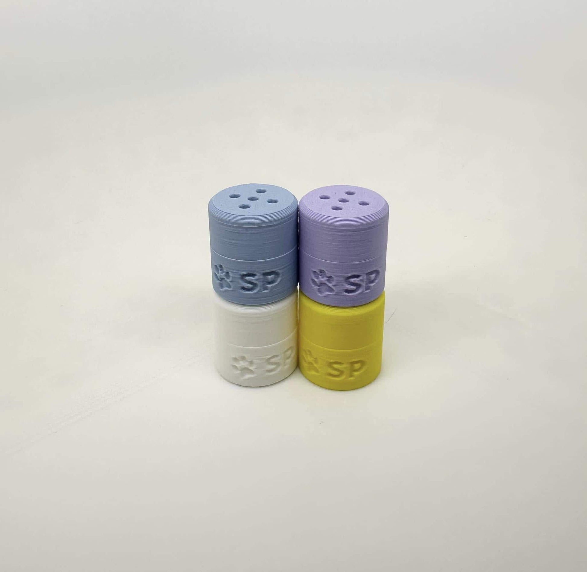 The Spring Tiny Hides pack for K9 nosework training includes Yellow, Periwinkle, White, and Ice Blue magnetic scent detection vessels. Made from durable, eco-friendly PLA, these hides are perfect for improving your dog’s scent detection skills.